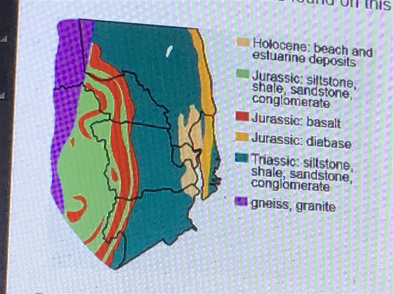 Where are the youngest rocks found on this geological map? A. The red area B. The-example-1