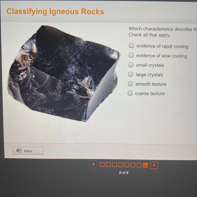 Which characteristics describe this rock sample?-example-1