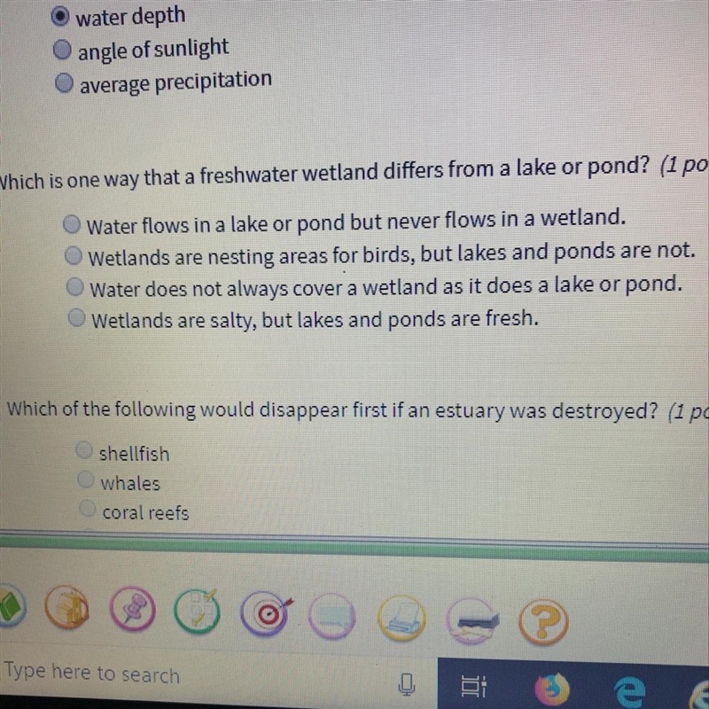 Which is one way that a freshwater wetland differs from a lake or pond?-example-1