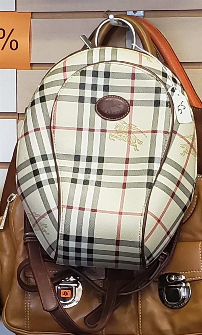 Bad picture, but a real Burberry bag? Haven't seen any in this style/shape. ​-example-1