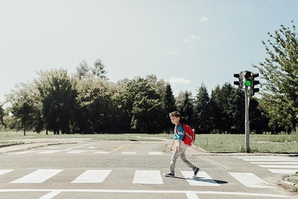 Does the child in the crosswalk have the right of way? Explain why or why not.-example-1