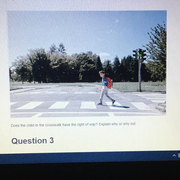 Does the child in the crosswalk have the right of way? Explain why or why not-example-1