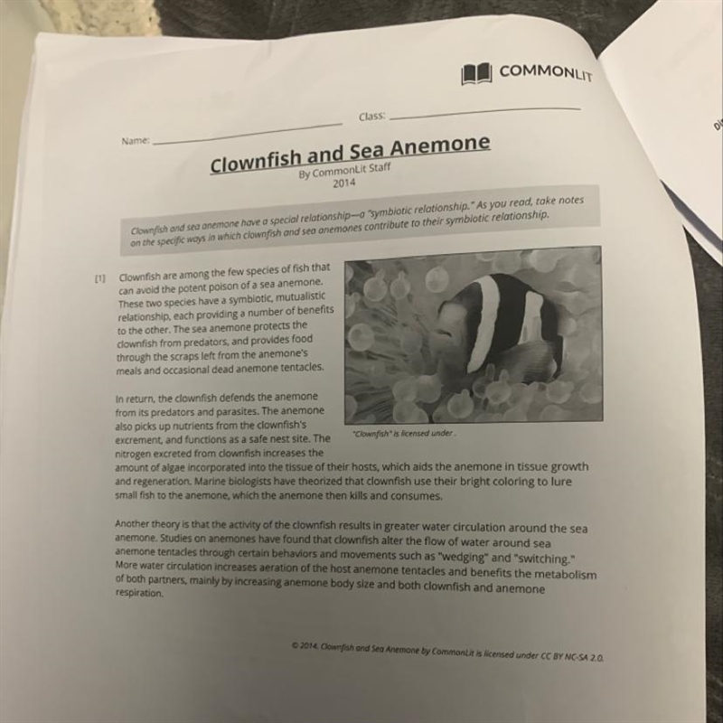 Question 1: How do clownfish contribute to the survival of the sea anemone?-example-1