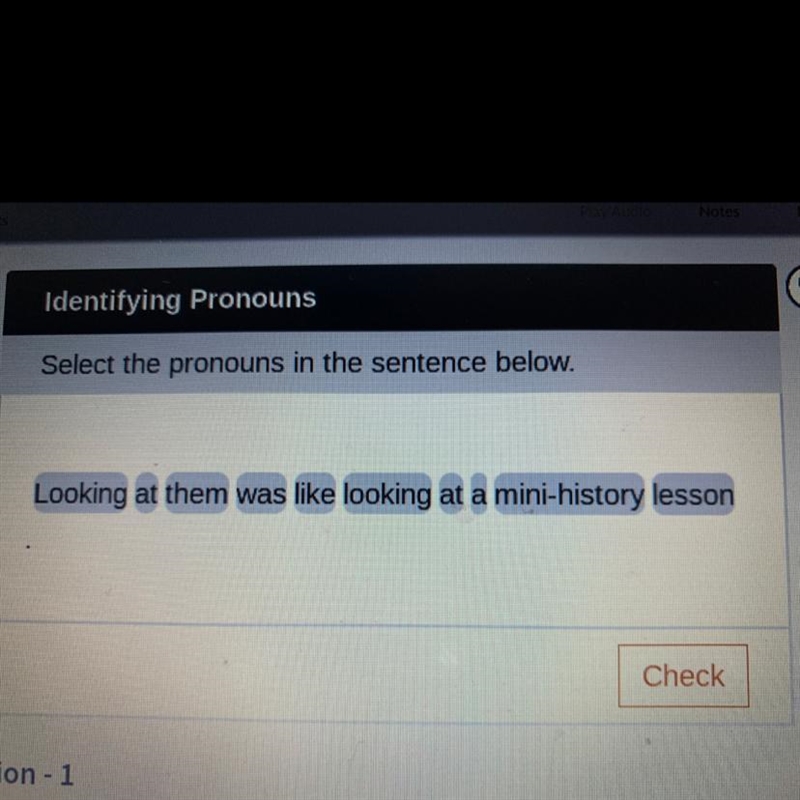 Select the pronouns in the sentence below. Looking at them was like looking at a mini-example-1