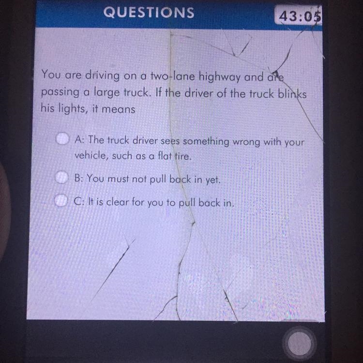 You are driving on a two lane highway and are passing a large truck if the driver-example-1