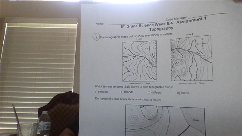 The topographic map below shows elevations in meters. Which features are most likely-example-1