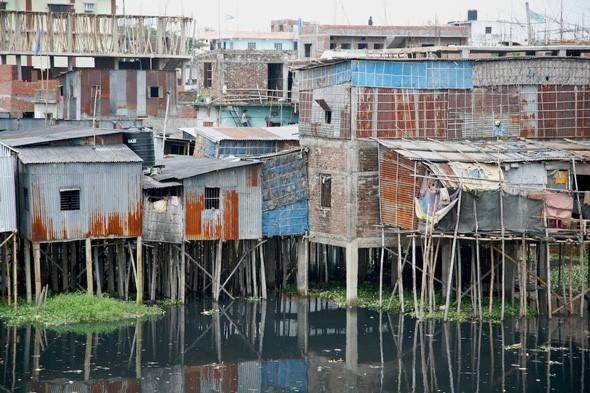 These houses are built in a flood prone area of Bangladesh. What is the term for the-example-1