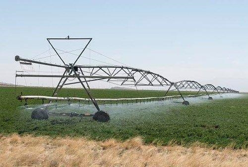 The picture of modern irrigation techniques demonstrate the ability for humans to-example-1