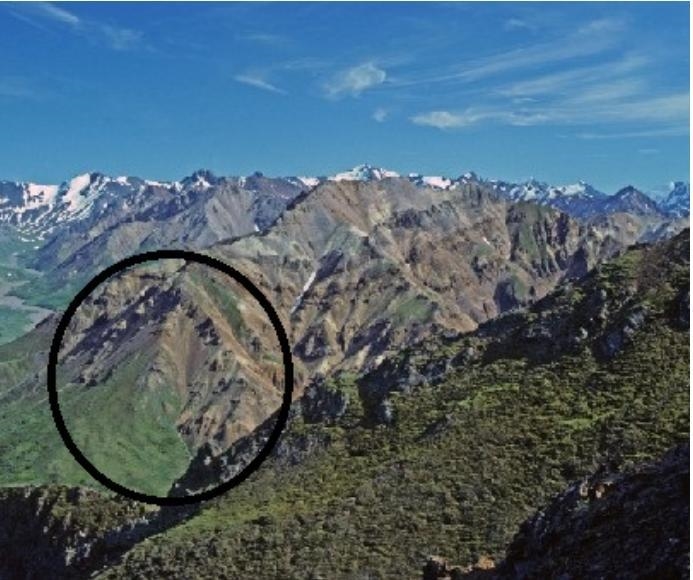 Which describes the circled area of these mountains? A syncline is visible. An anticline-example-1