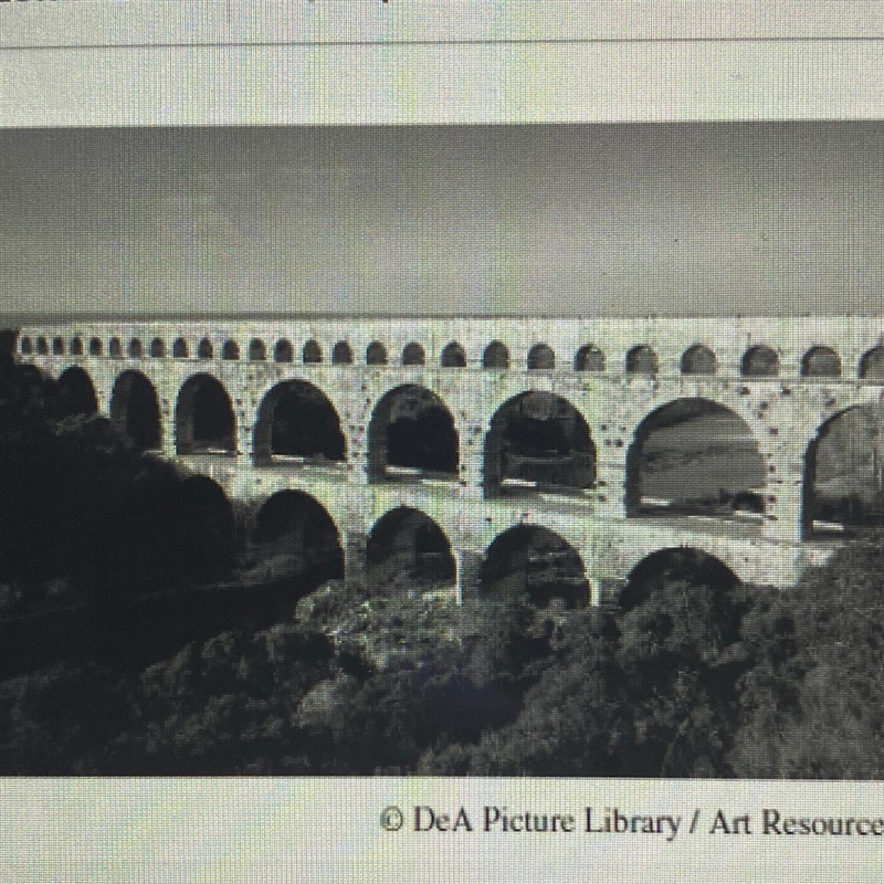 The Roman aqueduct in France (pictured above) is an example of which concept? A) religious-example-1