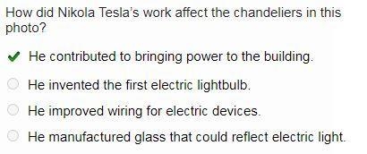 How did Nikola Tesla’s work affect the chandeliers in this photo?-example-1