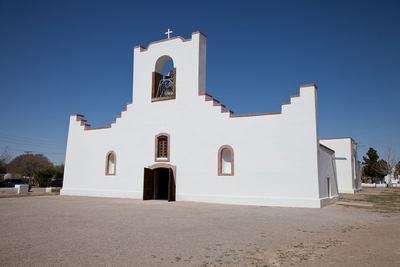 What do buildings such as the one shown above reveal about Spain's purpose for establishing-example-1