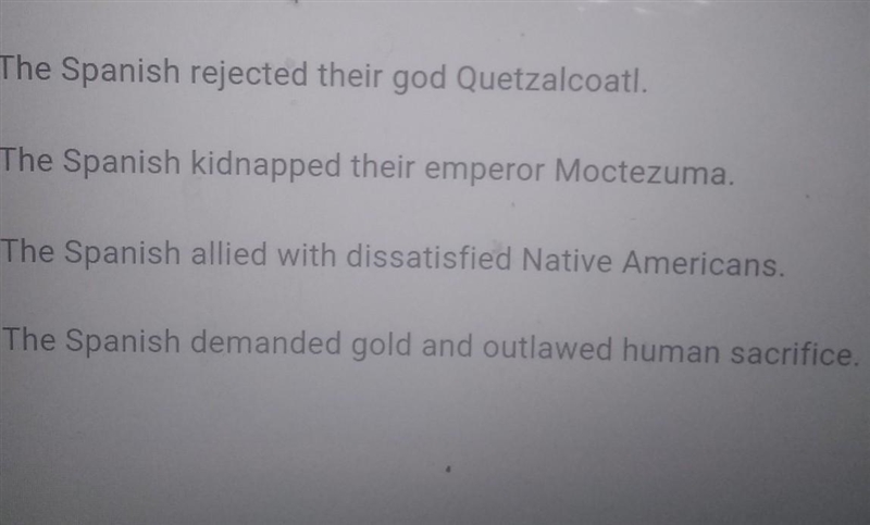 What caused the Aztec to rebel against Hernán Cortés and the Spanish?​-example-1