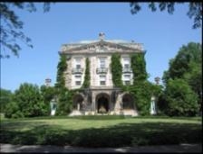 How is this photo of John D. Rockefeller’s mansion contrasted with this photo of laborers-example-1