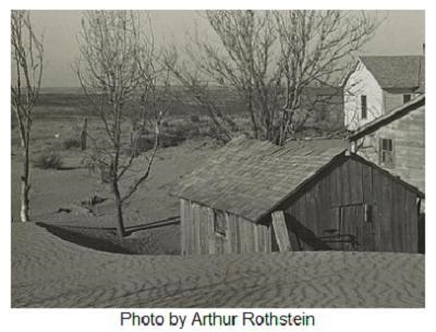 This photo was taken during the Great Depression. Small houses surrounded by dirt-example-1