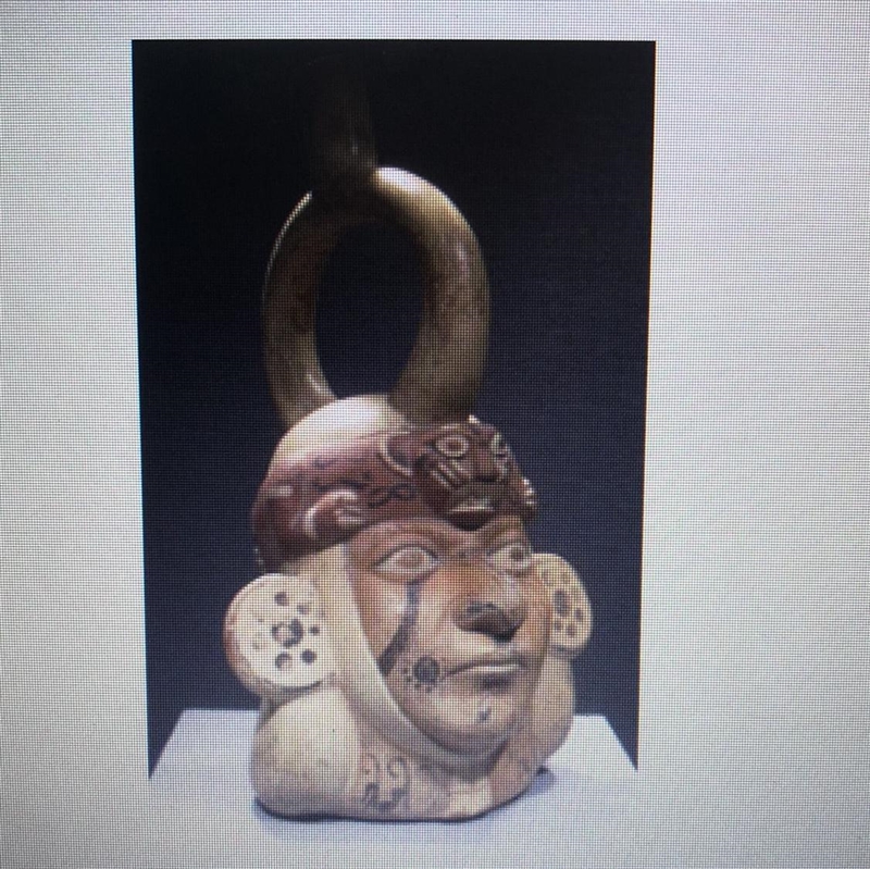 Look at this photograph. This sculpture of a warrior's head was produced in a. india-example-1