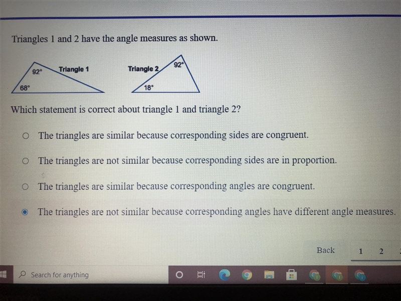 Triangles 1 and 2 have the angle measures as shown. Which statement is correct about-example-1