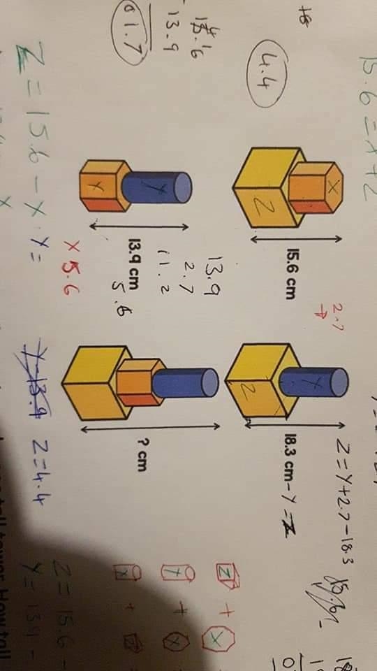 Tower one, a cube with a hexagonal prism measures 15.6cm. Tower two, a cube with a-example-1