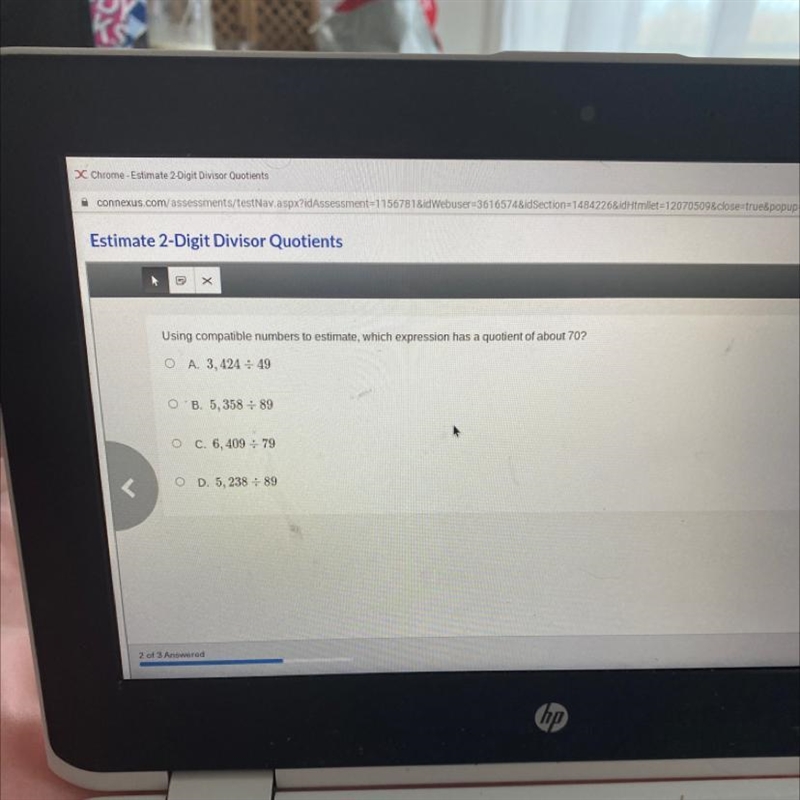 Using compatible numbers to estimate, which expression has a quotient of about 70? O-example-1