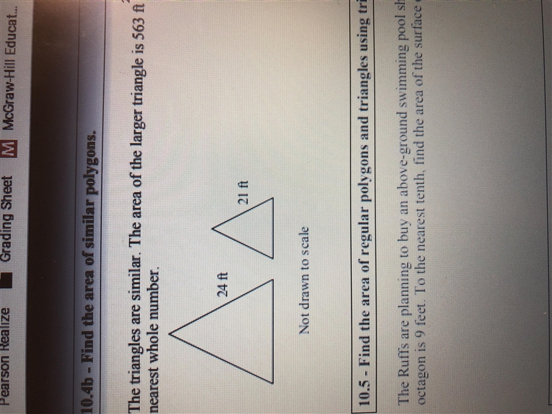 Two Triangles Are similar, The area of the larger triangle is 563 feet squared. What-example-1