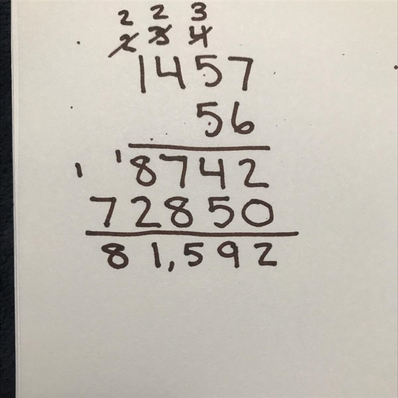 Use standard algorithm to solve 1,457 x 56​-example-1