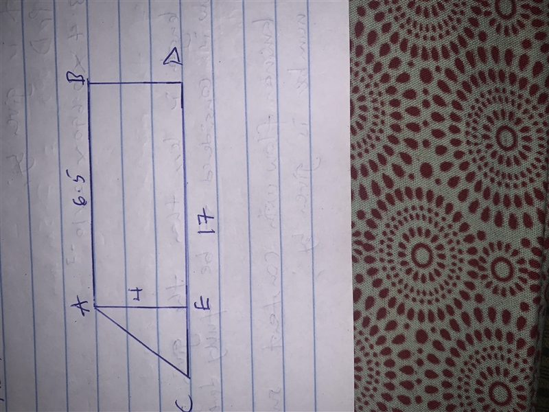 A patio is in the shape of a trapezoid. The length of the longer base is 17 feet. The-example-1