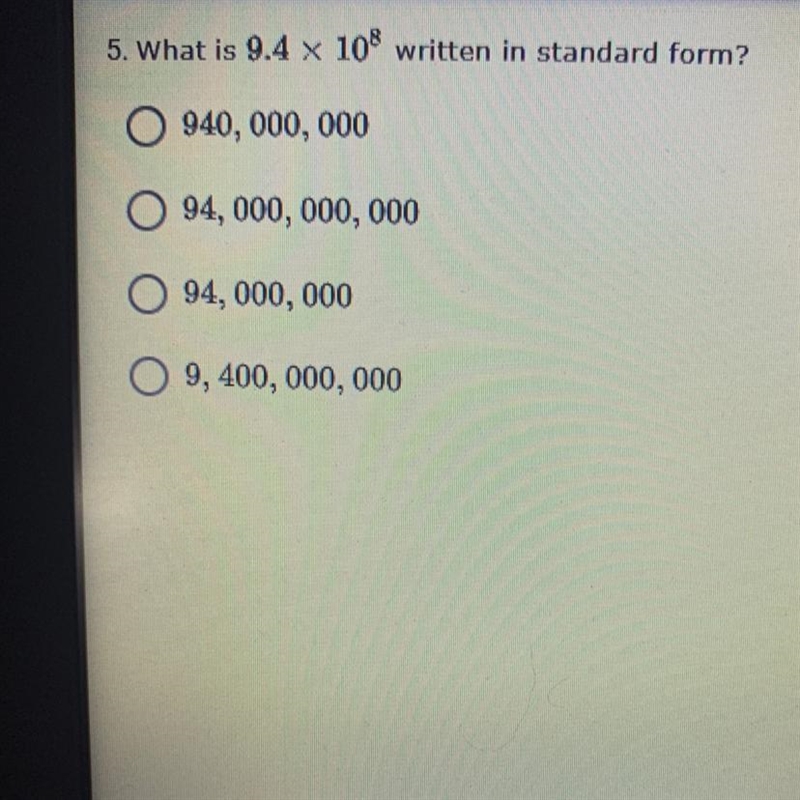 What is 9.4 x 10^8 written in standard form? Someone please help me!!!!-example-1