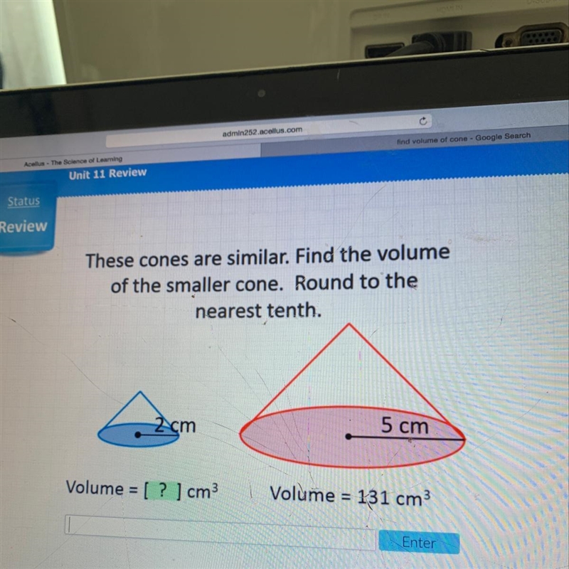 These cones are similar. find the volume of the smaller cone. round to the nearest-example-1