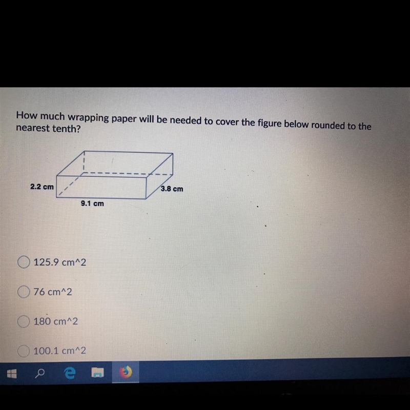 How much wrapping paper will be needed to cover the figure below rounded to the nearest-example-1