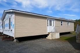 This is a mobile home. how much do you think it costs?-example-1