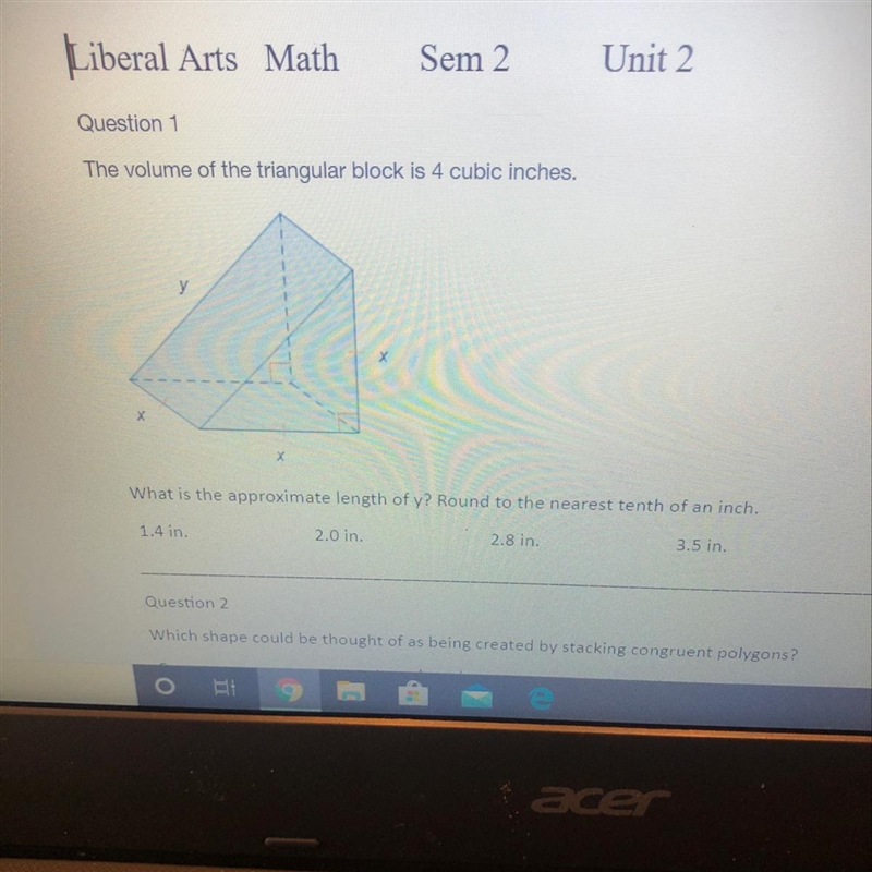 The volume of the triangular block is 4 cubic inches. What is the approximate length-example-1