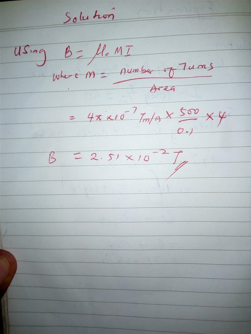 A solenoid with 500 turns, 0.10 m long, carrying a current of 4.0 A and with a radius-example-1