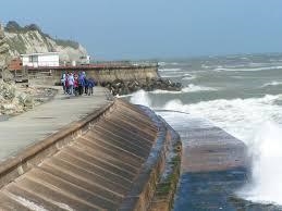 Ocean waves are partially reflected from the entrance to a harbor, where the depth-example-2