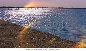 Ocean waves are partially reflected from the entrance to a harbor, where the depth-example-1