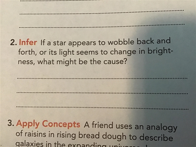 If a star appears to wobble back back and forth, or its light seems to change in brightness-example-1