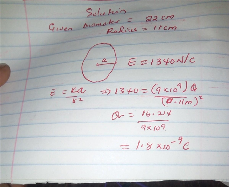 How many excess electrons must be distributed uniformly within the volume of an isolated-example-1