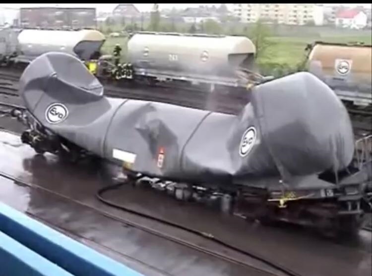 A train crew was cleaning out a rail tanker that had been emptied of its contents-example-1