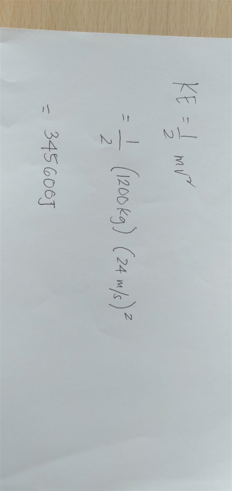 What is the kinetic energy of a 1200 kg roller coaster that is moving with a speed-example-1