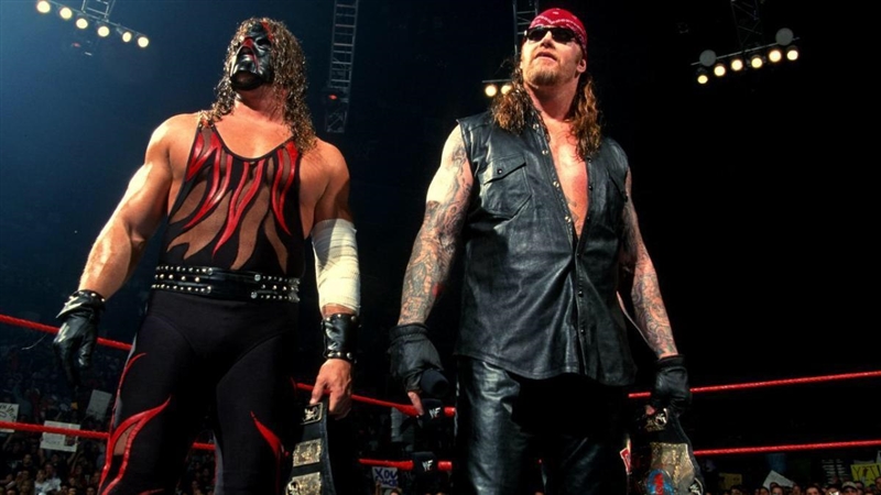 Kane or Undertaker and what was your favorite attire of the two partners of brothers-example-1