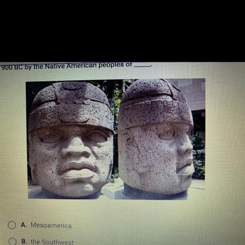 Look at this photograph. These colossal heads were produced around 1200 to 900 BC-example-1