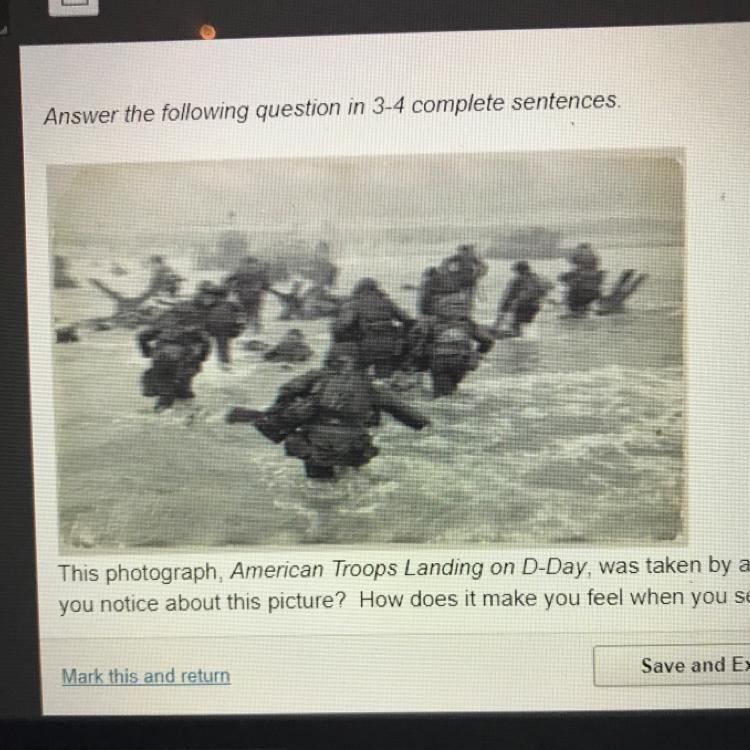 This photograph, American Troops Landing on D-Day, was taken by war correspondent-example-1