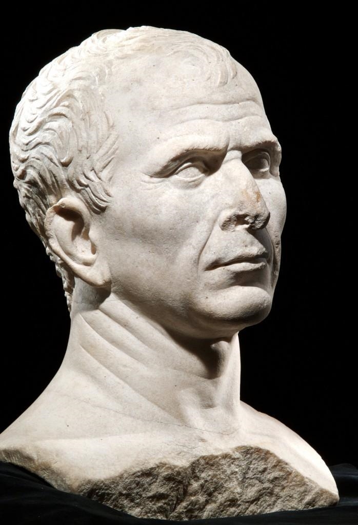 Look carefully at the facial features. How has the artist tried to make Caesar look-example-1