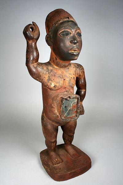 This example of a Nkisi Nkonde figure from the Kongo people of Africa is an example-example-1