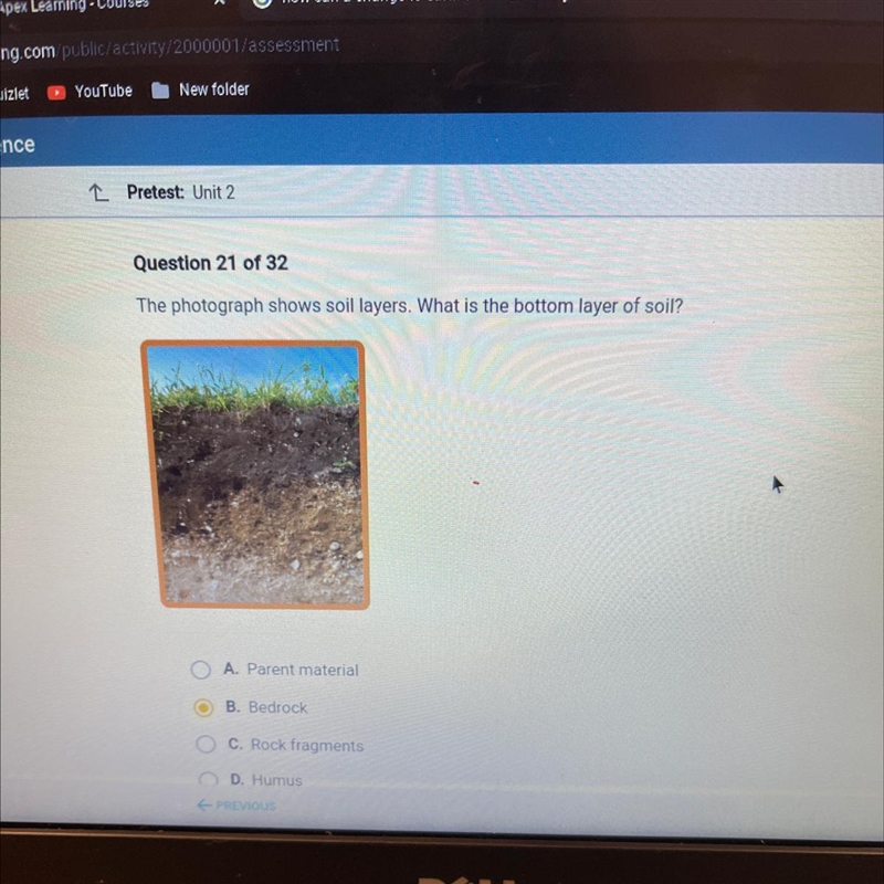 The photograph shows soil layers. What is the bottom layer of soil?-example-1