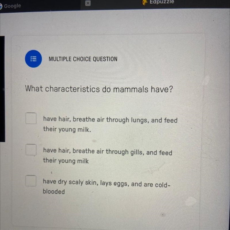 What characteristics do mammals have? have hair, breathe air through lungs, and feed-example-1