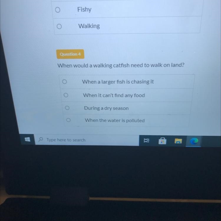 Question 4 When would a walking catfish need to walk on land? When a larger fish is-example-1