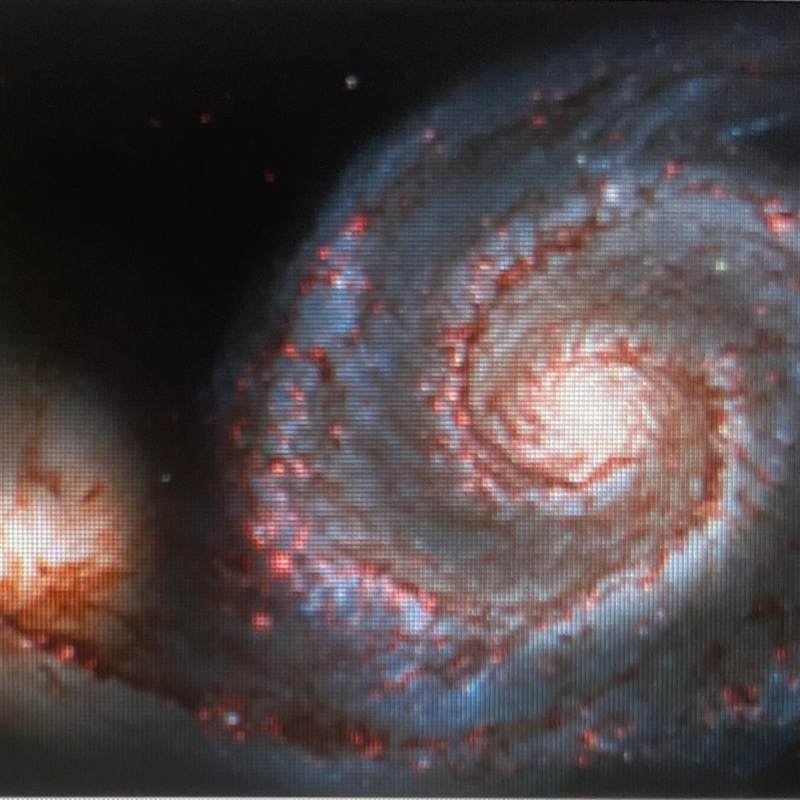 Which type of galaxy is pictured? A. Elliptical B. Irregular C. Spiral O D. Spherical-example-1