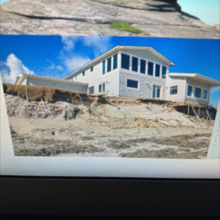 In the photo of the house; What is happening to the foundation of the house?-example-1