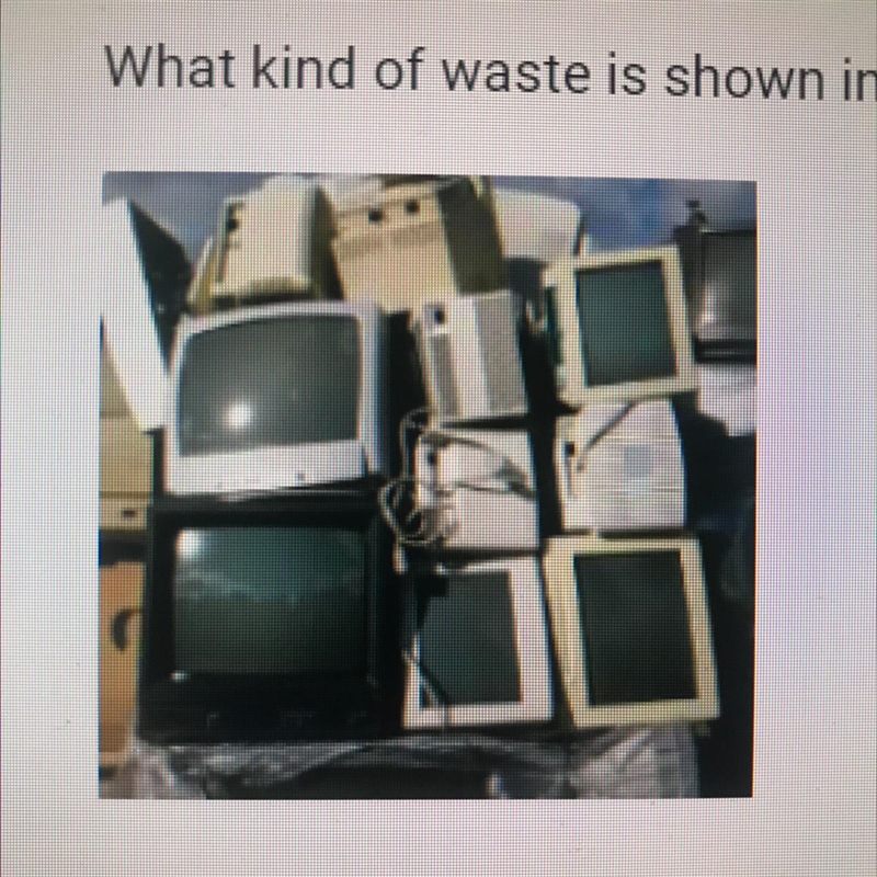 What kind of waste is shown in the photograph? O A. Industrial waste O B. E-waste-example-1