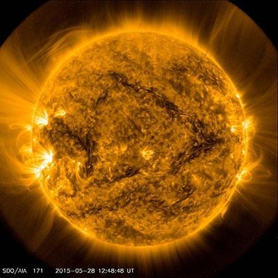 Which layer of the sun is shown extending into space in the picture above? Corona-example-1